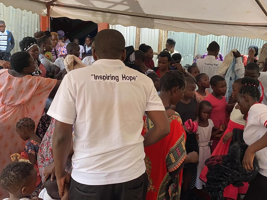 Volunteers helping with the clothing distribution